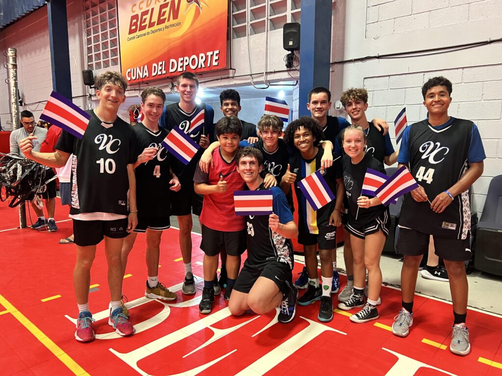 a team holding costa rican flags