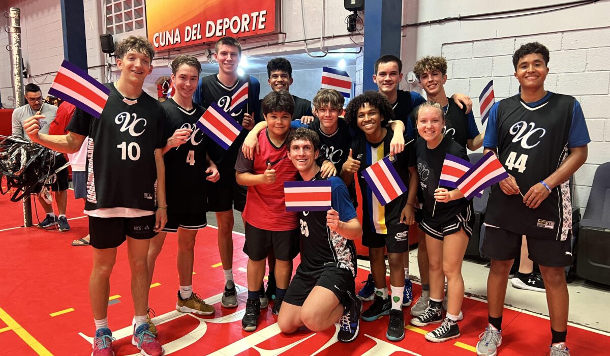 a team holding costa rican flags